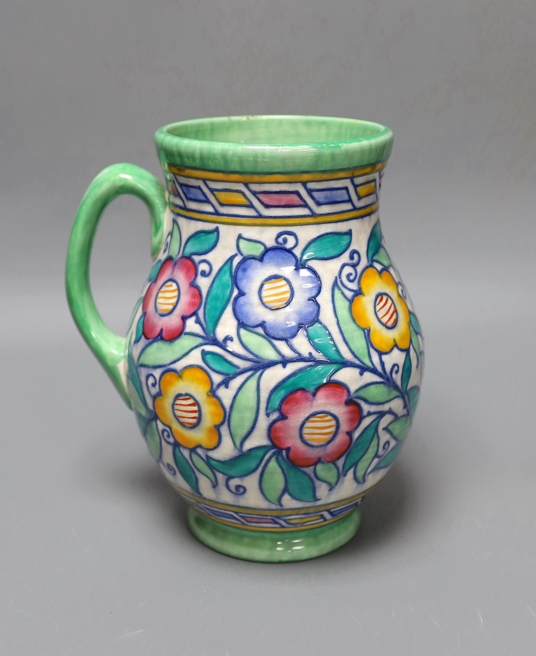 A Charlotte Rhead jug, 22 cms high.